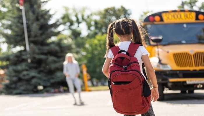 Girl Getting on School Bus